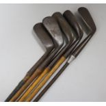 J. Brown Mashie, another two putters and a mid iron, Hickory shafted
