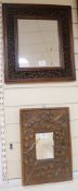 Two decoratively carved wooden wall mirrors