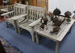 A Teak garden bench, 3 armchairs and a table W.161cm