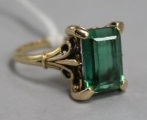 A green trap cut single stone ring