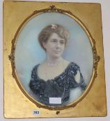 An Edwardian portrait of a lady in oval and gilt frame, 43 x 34cm