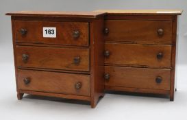 Two apprentice miniature chests of drawers