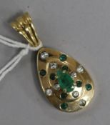 A diamond and emerald set pendant 4cm.