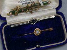 A jade, split pearl and gold brooch, a gold and opal brooch and one other