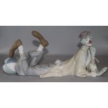 A Lladro recumbent clown with ball