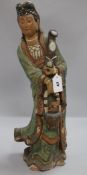 A Chinese polychrome-glazed terracotta figure of Guanyin, with ruyi sceptre and basket (some