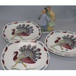 A Royal Copenhagen Chinese figure group and three Midwinter plates