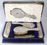 A six-piece silver-mounted dressing table set, cased, Birmingham 1900