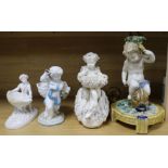 A Majolica putti lamp and three putti table centres (some damage)