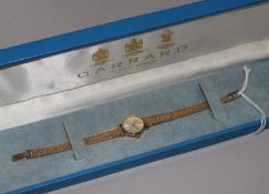 A lady's 9ct gold Garrard wrist watch