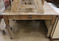 A pine kitchen table, W.104cm