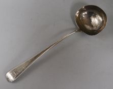 A Victorian silver soup ladle G.A. London 1868