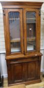 A Victorian walnut bookcase cupboard, H.203cm