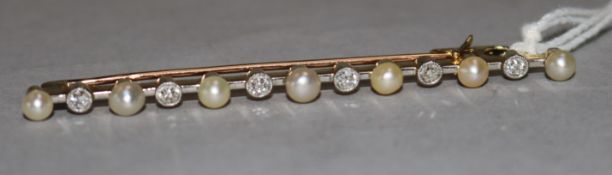 A diamond and pearl bar brooch 6.5cm.