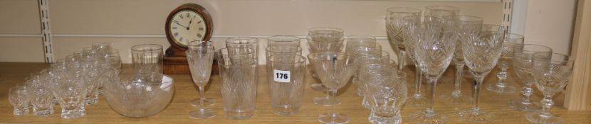 A part suite of hob nail and fan cut drinking glassware and a clock