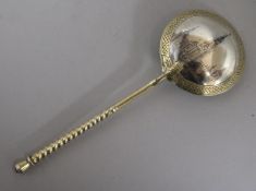 A 19th century Russian silver gilt and niello spoon 84 zlotnik, dated 1878, 7in.