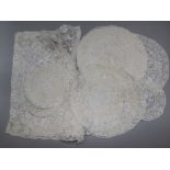 A set of Normandy lace place mats and table centre