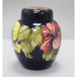 A Walter Moorcroft Hibiscus pattern jar and cover