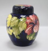 A Walter Moorcroft Hibiscus pattern jar and cover