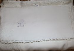 A linen embroidered banqueting cloth and napkin set