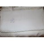 A linen embroidered banqueting cloth and napkin set