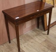 A mid Victorian mahogany inlaid folding tea table, W.91cm