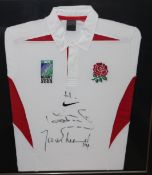 Four framed rugby shirts, bearing signatures