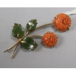 A gold, carved coral and jade rose brooch, 50mm.