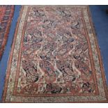 A Serabend rug with all-over boteh design in red, pink, blue and ivory, 195cm x 125cm