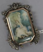 A 19th century continental white and yellow metal pendant brooch, with seed pearl set border and