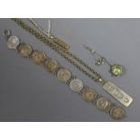 A 9ct gold ingot necklace, a similar silver necklace, a coin bracelet and a paste necklace.