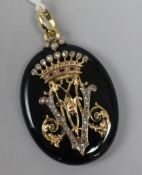 A Victorian gold, rose cut diamond and ruby set black enamel oval pendant locket, 49mm.