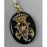 A Victorian gold, rose cut diamond and ruby set black enamel oval pendant locket, 49mm.