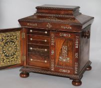 A Victorian mother of pearl-inlaid rosewood work-cum-stationery cabinet, fitted compartment and