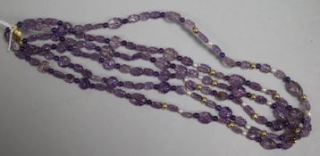 A double strand carved amethyst bead necklace with 9ct gold clasp and cultured pearl and gilt sphere