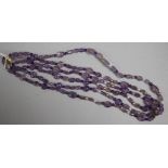 A double strand carved amethyst bead necklace with 9ct gold clasp and cultured pearl and gilt sphere