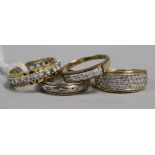 An 18ct gold Zirconium-set ring, two similar 9ct gold rings and another stone-set unmarked ring