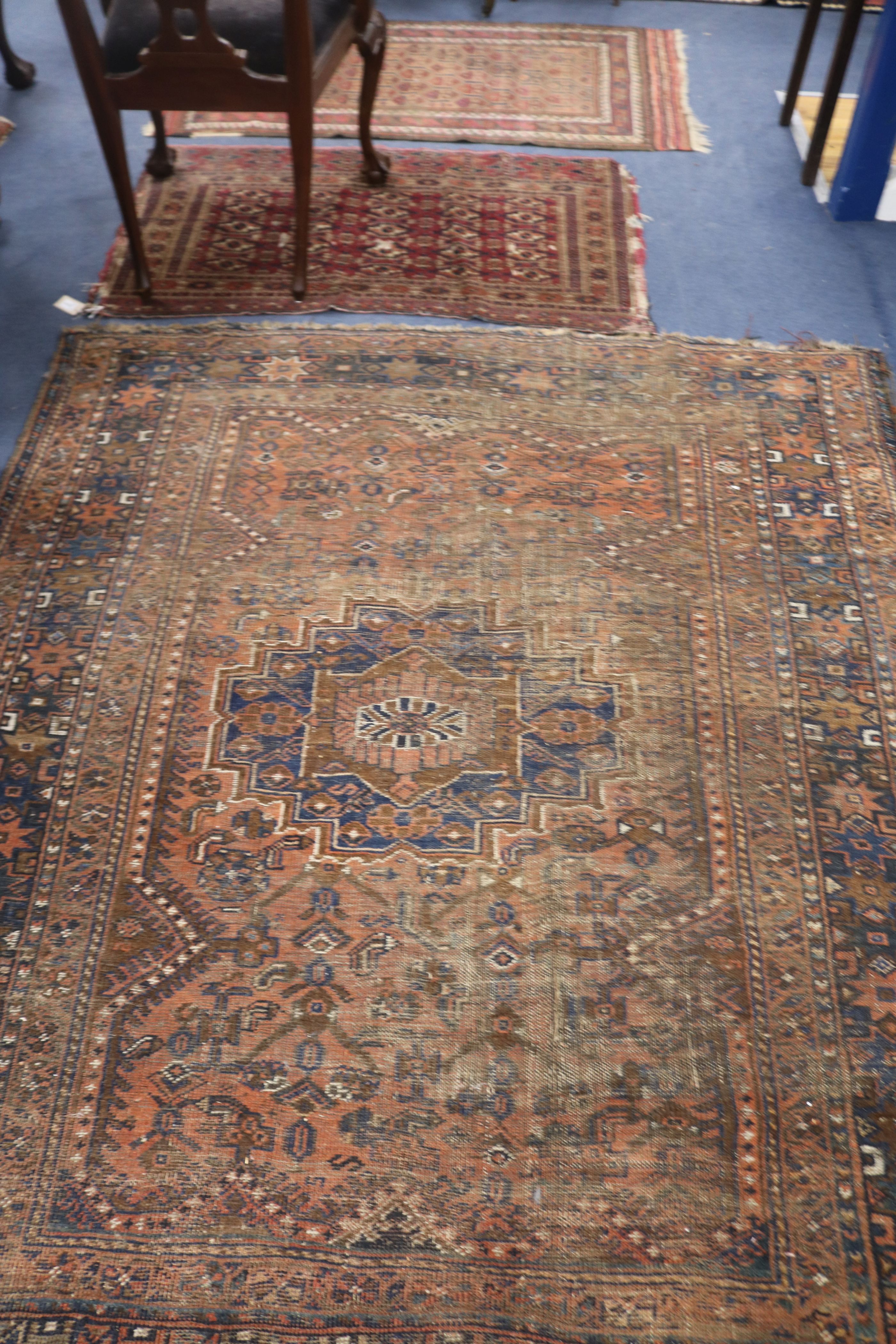 A Shiraz rug, a Bokhara saddlecloth and another rug (wear) 200 x 155cm, 120 x 75cm & 140 x 85cm