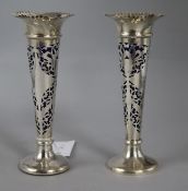 A matched pair of Edwardian pierced silver posy vases with blue glass liners, Birmingham, 1903 &