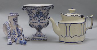 A Continental blue and white figural animal candlestick, an urn-shaped vase and a Castleford