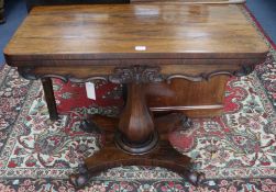A Victorian rosewood folding top card table on column and quadripartite base, W.91cm