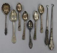 Two silver handled button hooks, a sterling silver teaspoon, a silver preserve spoon and five plated