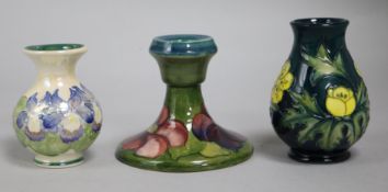 A Moorcroft vase, a clematis candlestick and a Moorland vase