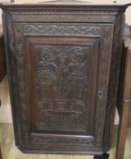 A late Victorian carved mahogany hanging cupboard, H.92cm