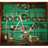 A bronze canteen of cutlery, in leather case