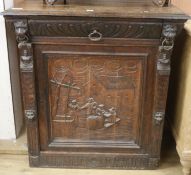 A 19th century Flemish carved oak cupboard, W.91cm