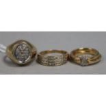 A 9ct gold and small diamond 'kiss' ring and two other 9ct gold and diamond rings, gross 12.7gr