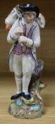 An early Staffordshire Walton-type figure of a shepherd carrying a lamb, on naturalistic base, H 7.