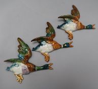 A group of eight Beswick graduated flying ducks