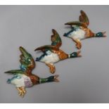 A group of eight Beswick graduated flying ducks